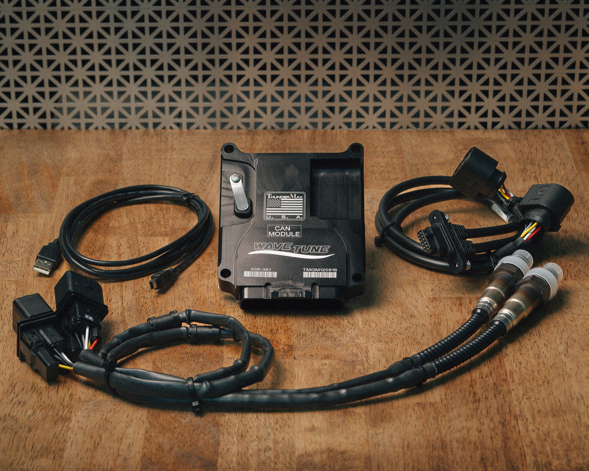 ThunderMax 309-361 ECM, wideband oxygen sensors and wiring laid out on a wooden workbench