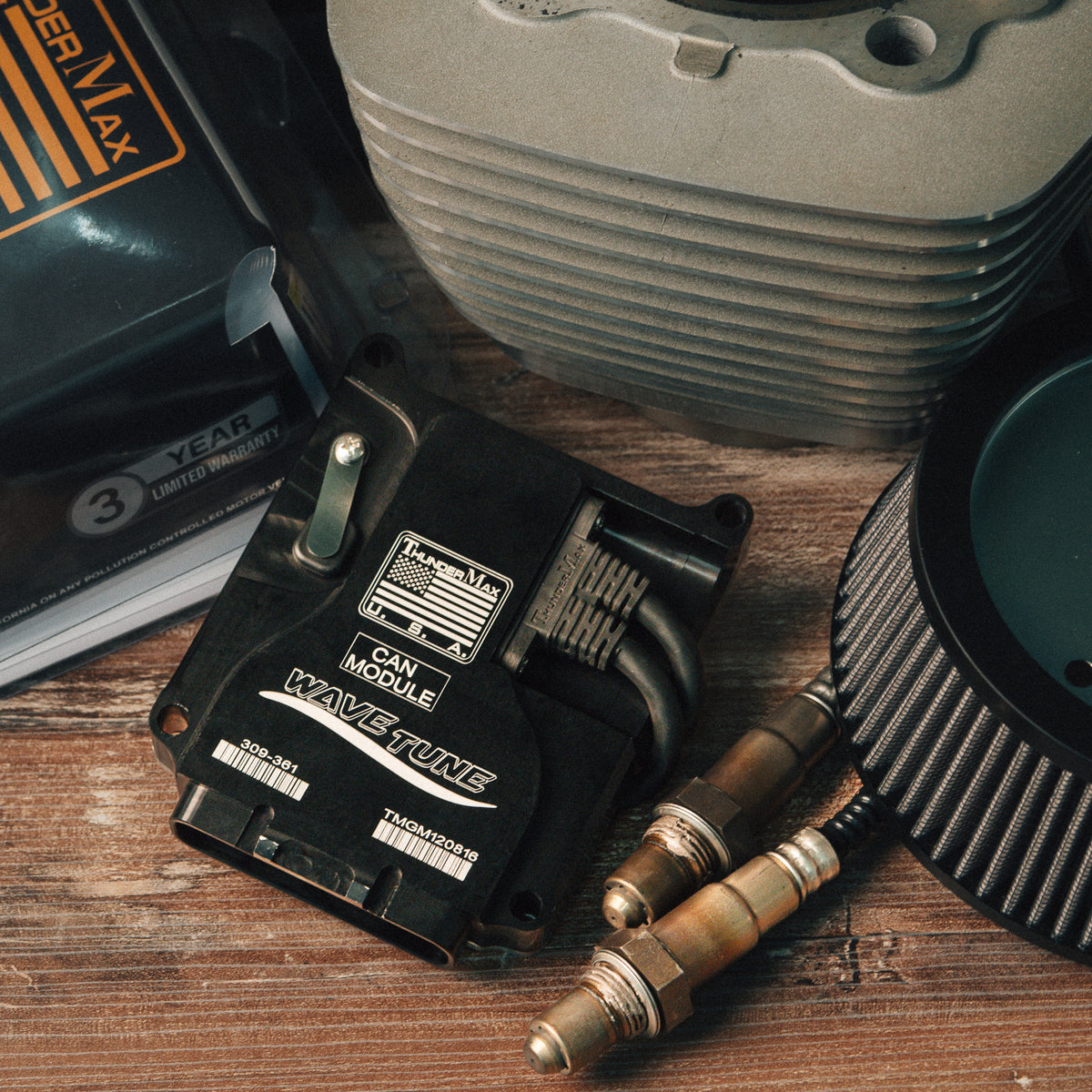 ThunderMax 309-361 ECM and wideband oxygen sensors beside an air filter