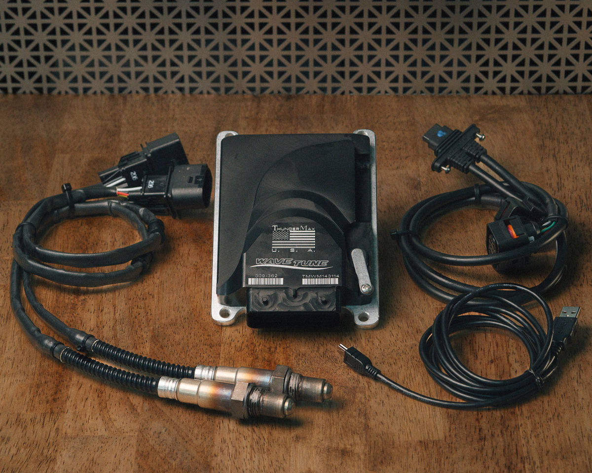ThunderMax 309-362 ECM, wideband oxygen sensors and wiring laid out on a wooden workbench