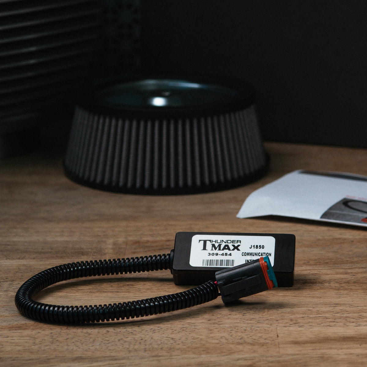 ThunderMax 309-454 J1850 communication module on a wooden workbench