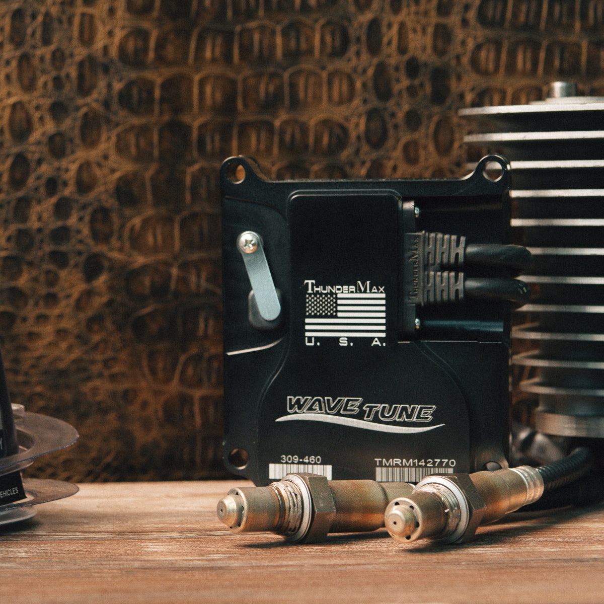 ThunderMax ECM and wideband oxygen sensors displayed beside engine cylinders