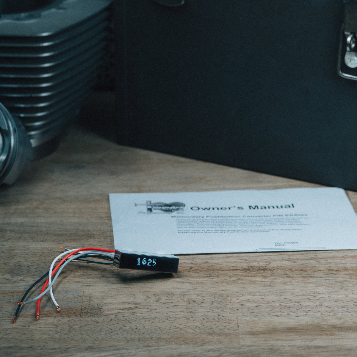 EA4093 pushbutton converter and wiring beside its instruction sheet
