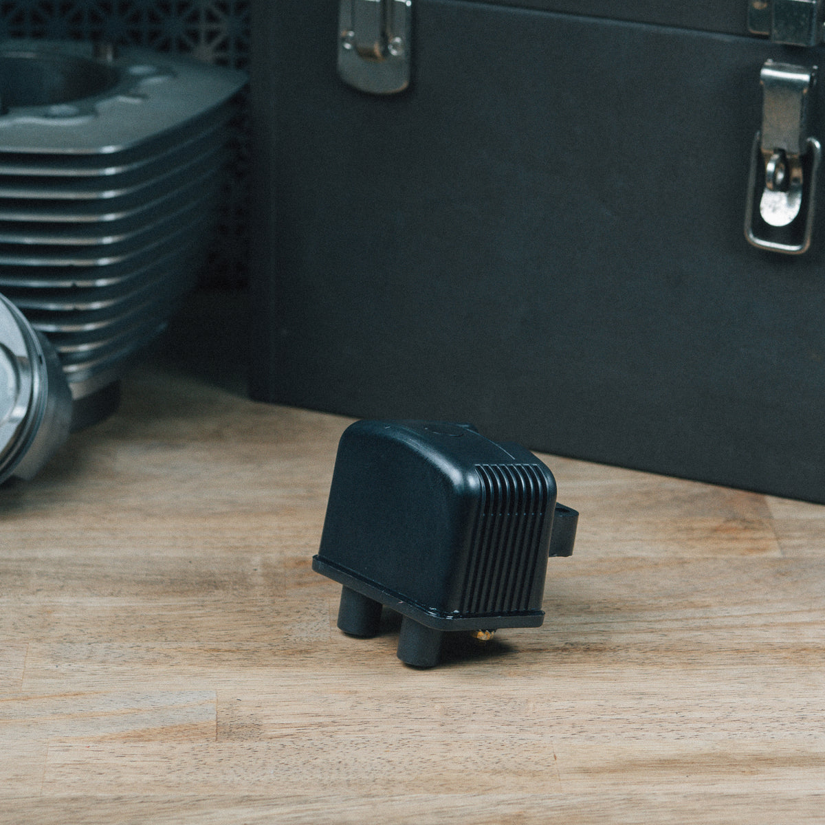 Twin Cam ignition coil on a wooden workbench