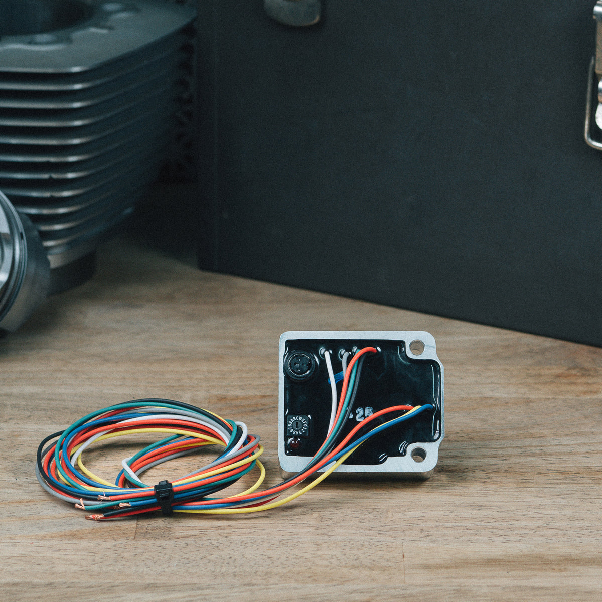 Programmable ignition module with colored wiring and an open metal housing