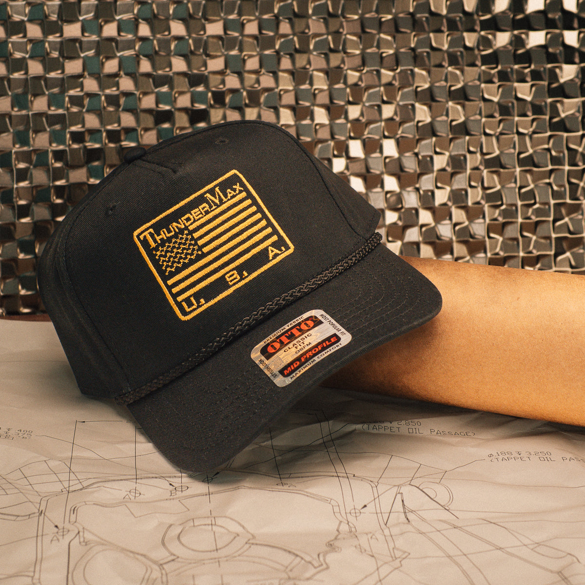 Dark TMax Flag Rope hat with gold flag patch and rope detail across the bill