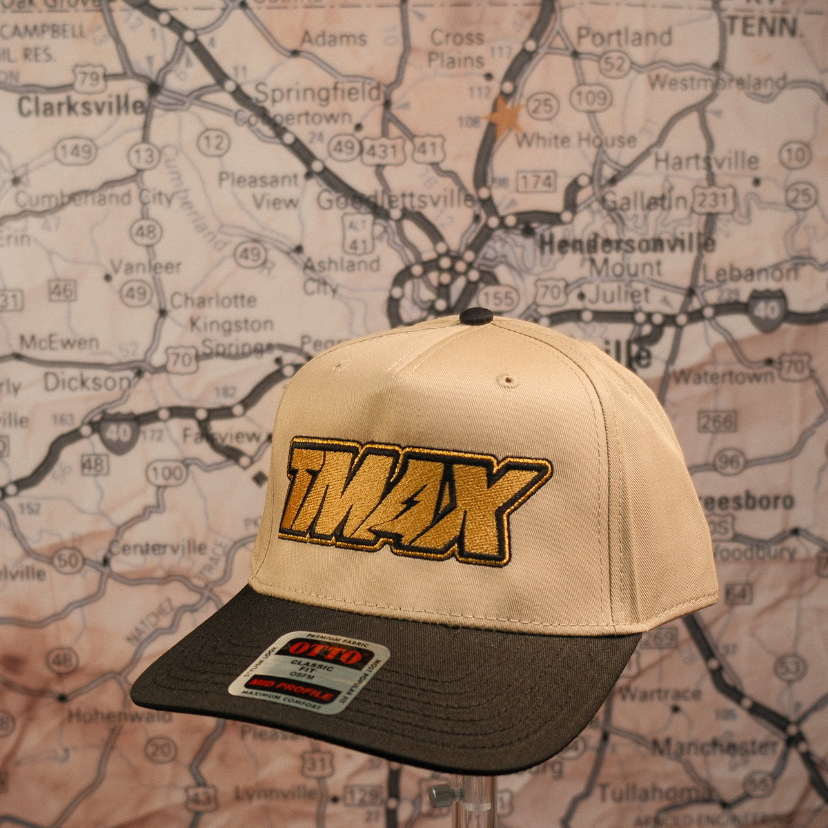 TMax Steppin’ Out hat with light crown, dark bill and gold TMAX lettering